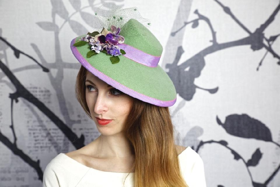 IMAGE - Handblocked mint mini sized felt hat. Decorated with lilac ribbon, vintage violet flowers and vintage green net. Stays on with and elastic and a wigclip.