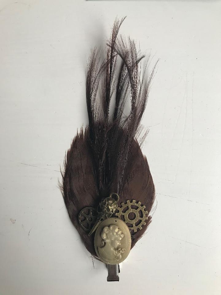 IMAGE - Brown featherpas hairpin with gold cameo, bronze gears and birdskull.
