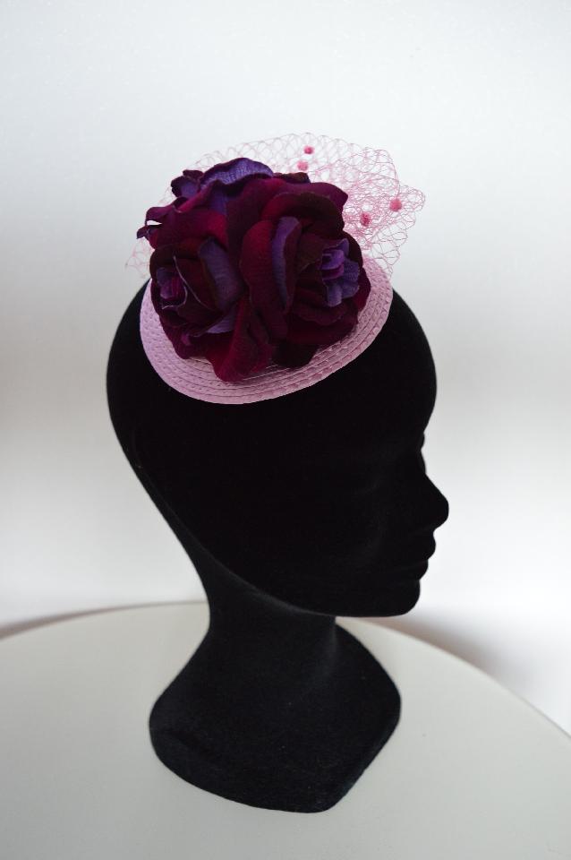 IMAGE - Lilac straw fascinator with purple velvet finish roses and pink net.
Fixes to hair with a comb.