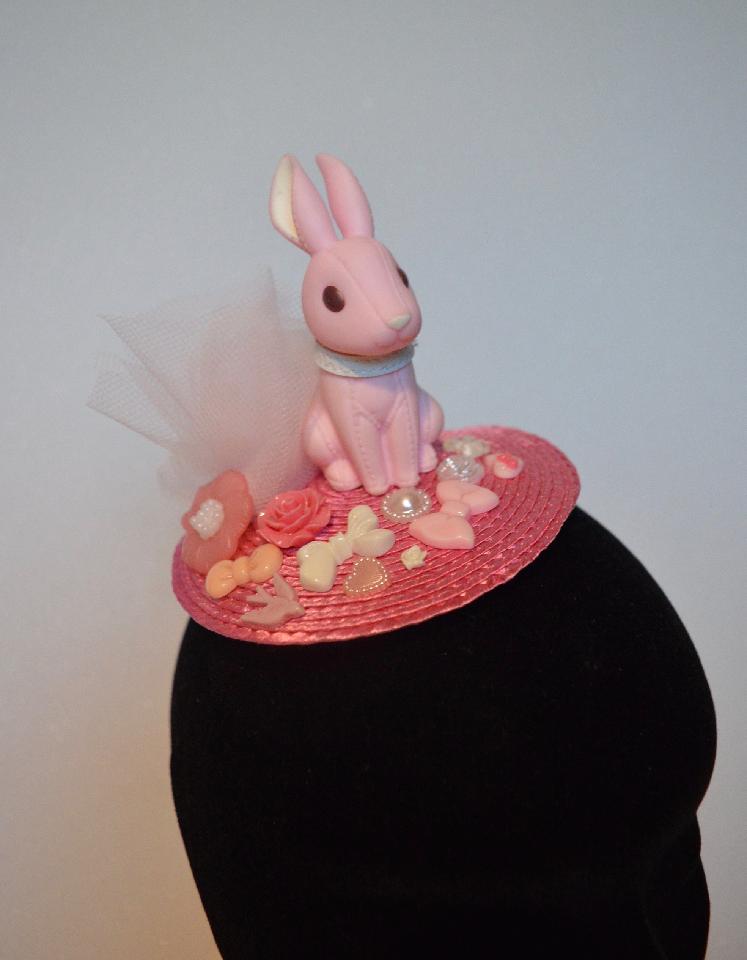 IMAGE - Pink fascinator with light pink tulle, bunny and ornaments. Fixes to hair with a comb.