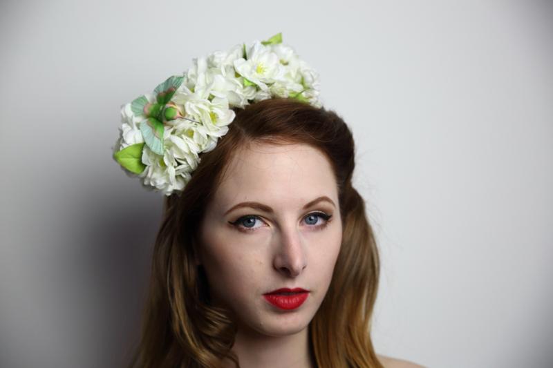 IMAGE - White headband with white flowers and green hummingbird. Mini comb is added for extra support.