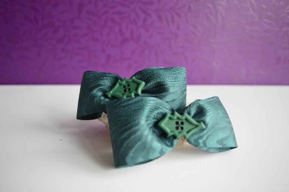 IMAGE - Set of two dark green hairpins with holly leaves.