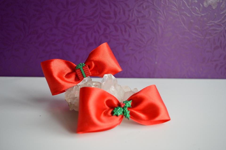 IMAGE - Red satin hairpins with present and glittered holly leaves.